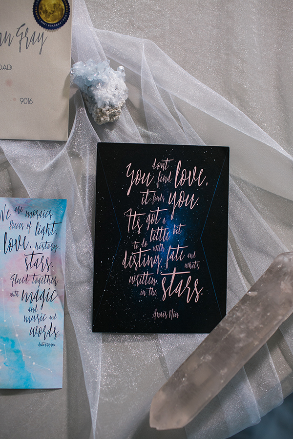 Constellational wedding invitation with typography inspired by astrological symbols