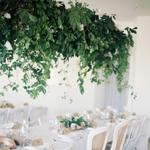 Rustically elegant tablescape with suspended greenery