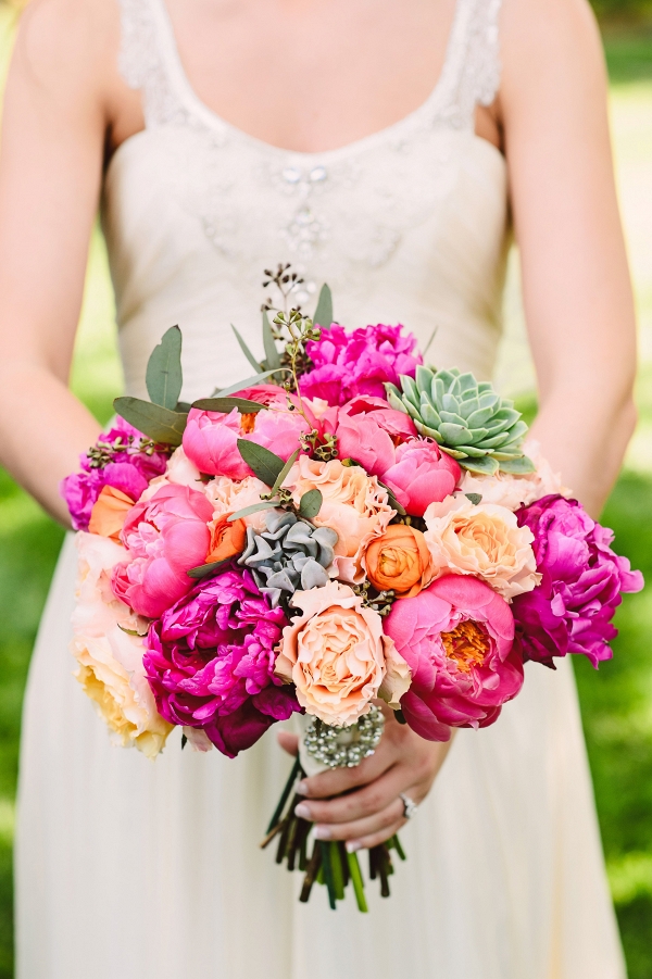 Bright spring bouquet with peonies, succulents, and garden roses