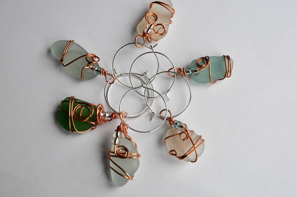 Wine glass charms made from wire-wrapped Scottish sea glass