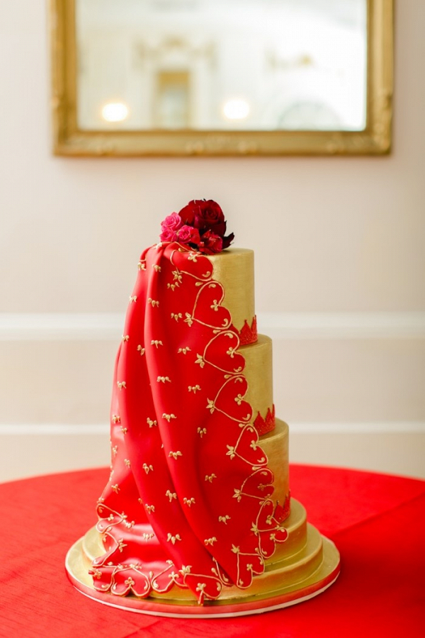 Red and gold draped wedding cake