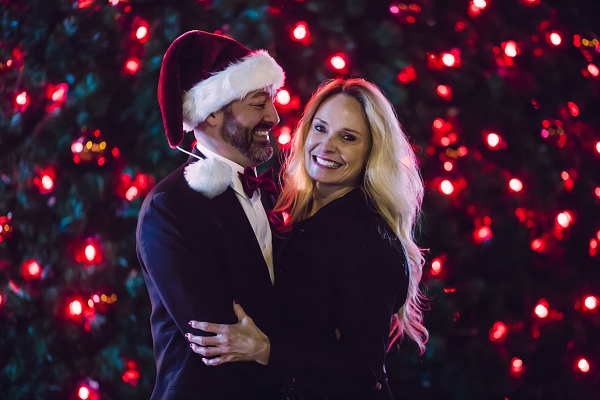 engagement photos in front of Christmas tree
