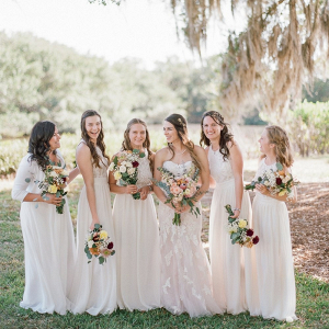 Bridesmaids in white lace dresses