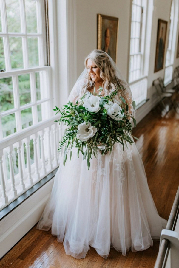 Bride with oversized greenery bouquet