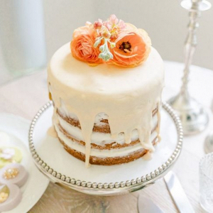 Drip wedding cake with fresh flower topper