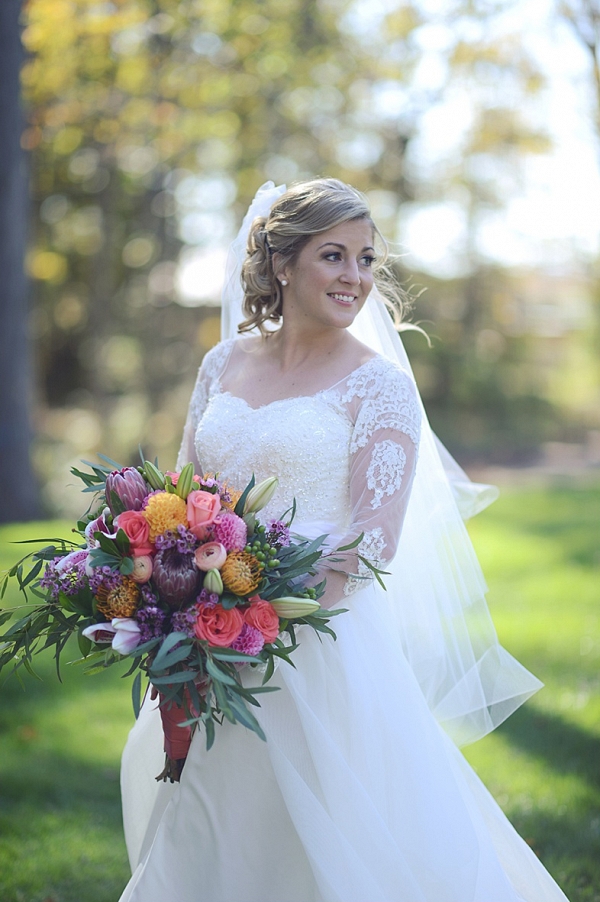 bride in long sleeve wedding gown on The Budget Savvy Bride