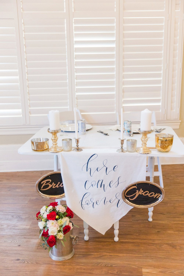 Sweetheart table with calligraphy signage
