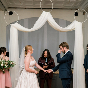Hoop and drapery ceremony backdrop
