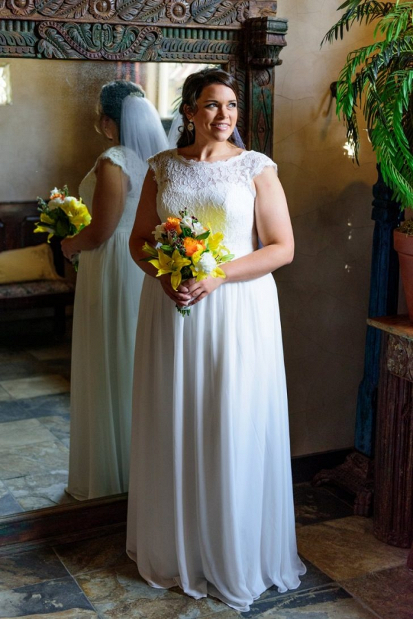 Bride with orange and yellow bouquet