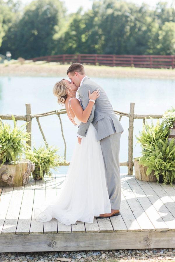 First kiss at lakeside ceremony
