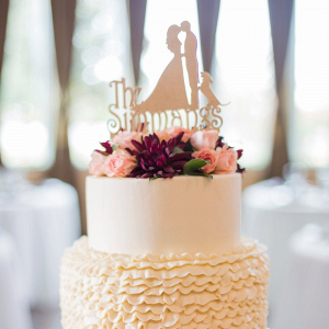 Ruffle wedding cake with silhouette cake topper