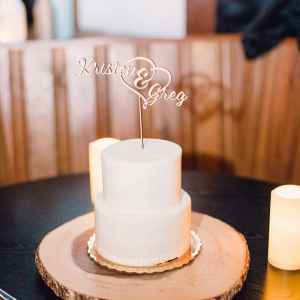 Rustic wedding cake with laser cut topper