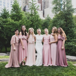Bridesmaids in long mismatched pink dresses