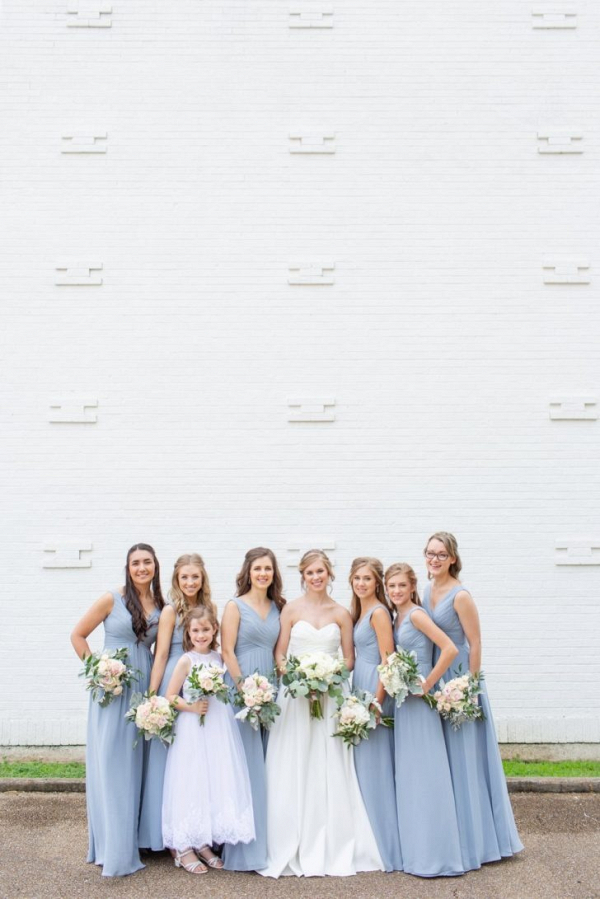 Bridesmaids in long blue gray dresses