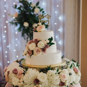Classic white wedding cake with fresh florals