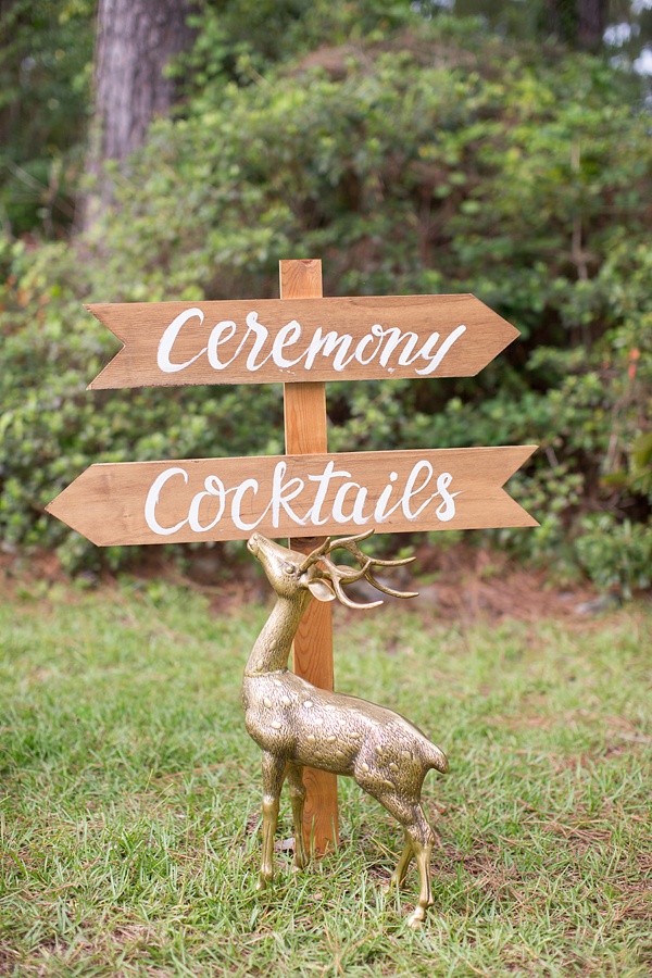 Gold deer with wooden wedding sign