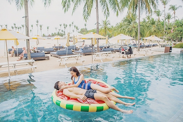 Newlyweds on pool float