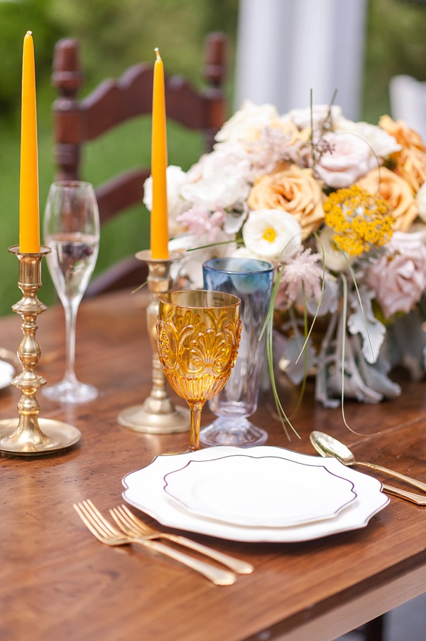 Mustard colored glassware and candles
