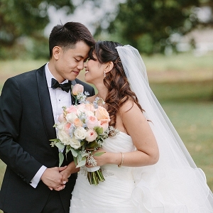 Filipino bride and groom with classic florals