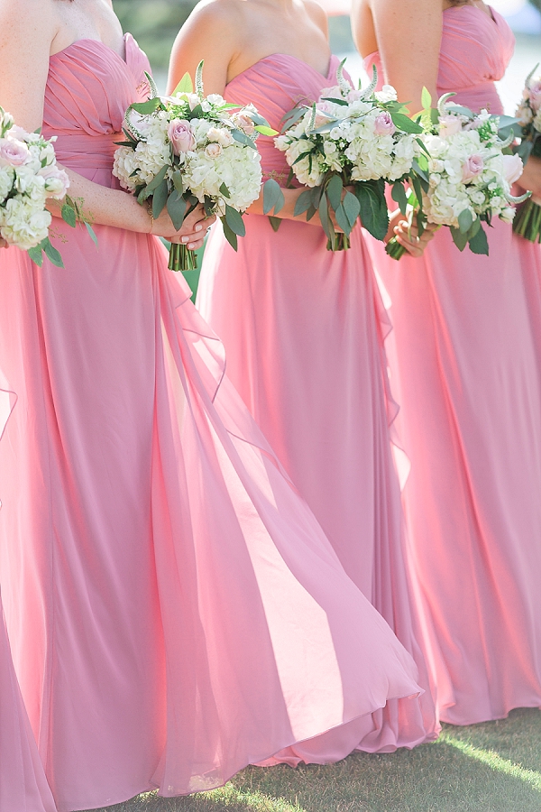 Pink bridesmaid dresses and bouquets