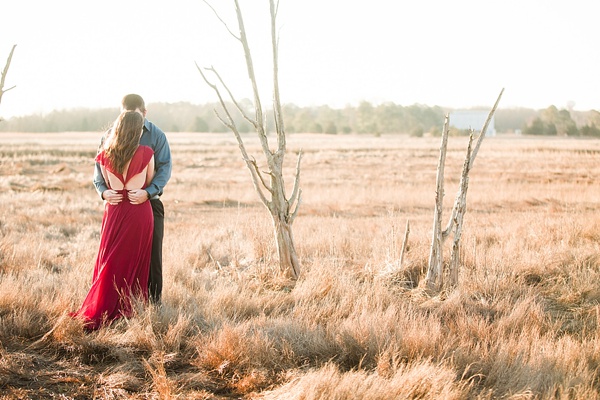 Engaged couple with gorgeous red dress