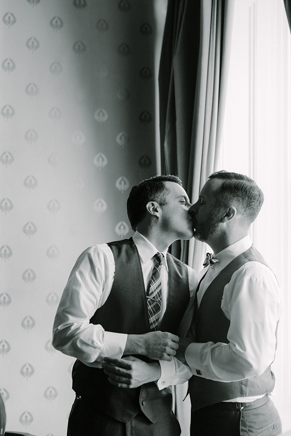 Two grooms share a kiss