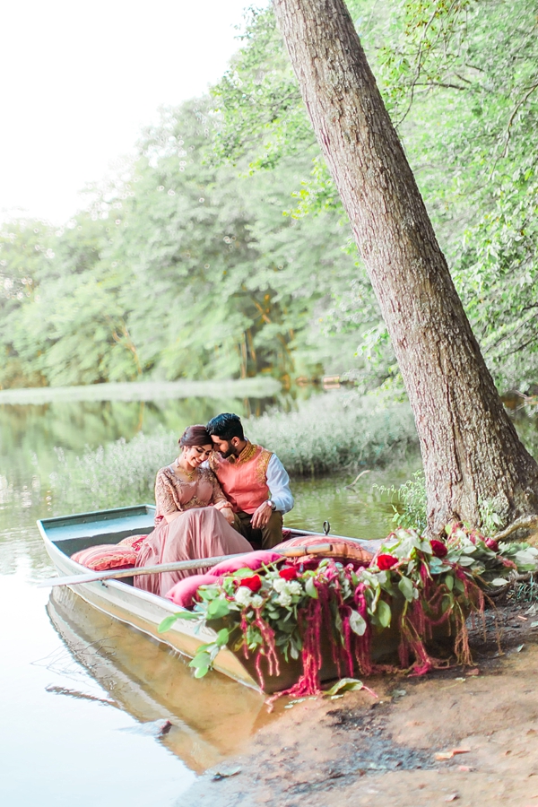 South Asian bride and groom in floral boat
