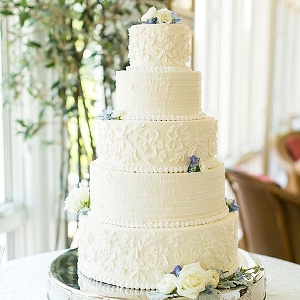 Tiered wedding cake with ruffles