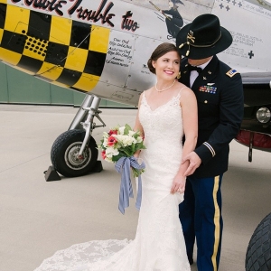 Bride and military groom at aviation museum