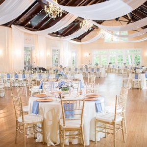Gold and blue wedding reception with draping