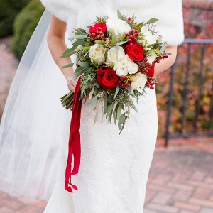 Christmas wedding bouquet with red velvet ribbons