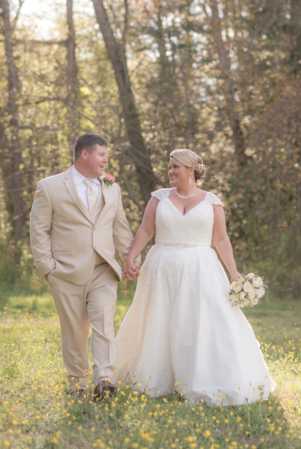 Country bride and groom in a meadow
