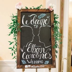 Chalkboard wedding sign with silhouettes