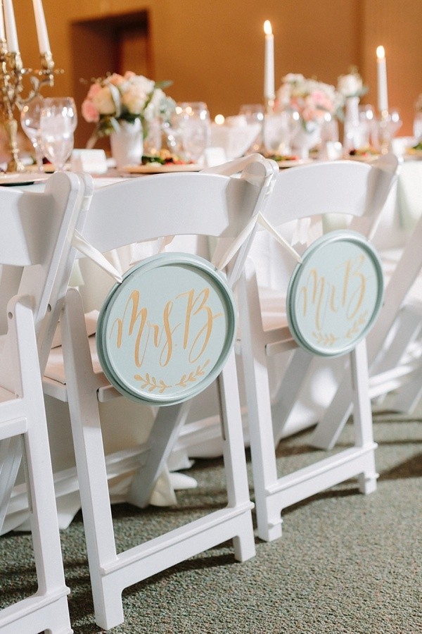 Bride and groom chair signs