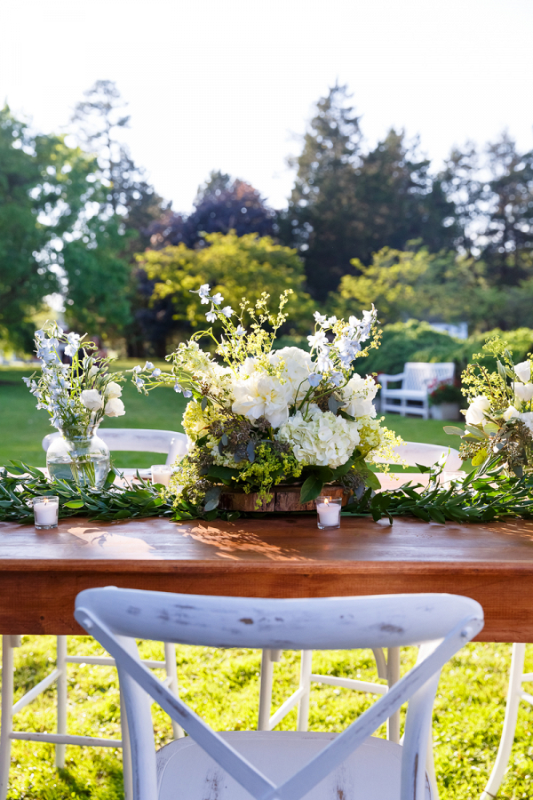 Textured Centerpiece and Greenery Runner on Farm Tables