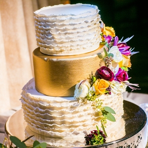 Ruffled gold painted wedding cake