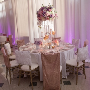 Orchid and rose tall lavender wedding centerpiece