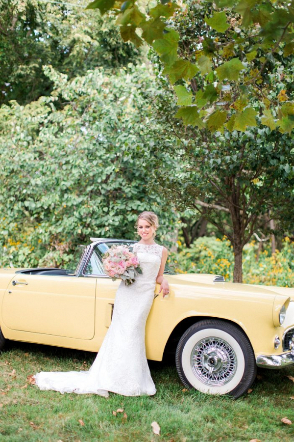 Bride with yellow vintage car
