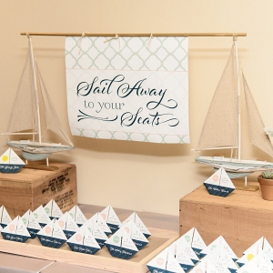 Sail away escort cards as origami boats 
